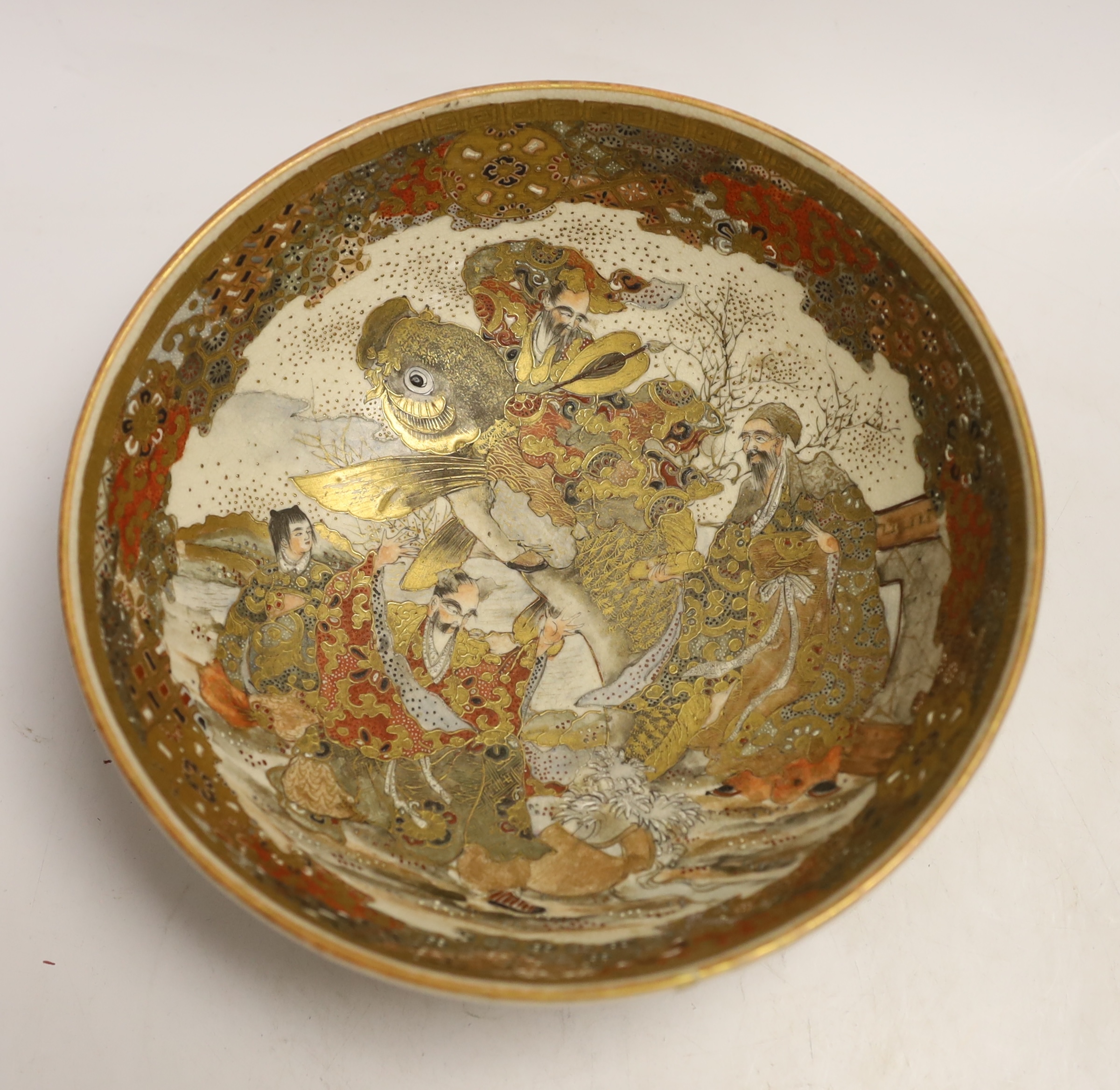 A Japanese Satsuma bowl, depicting Kinko riding a carp, Meiji period, impressed maker’s mark, 21.5cm diameter